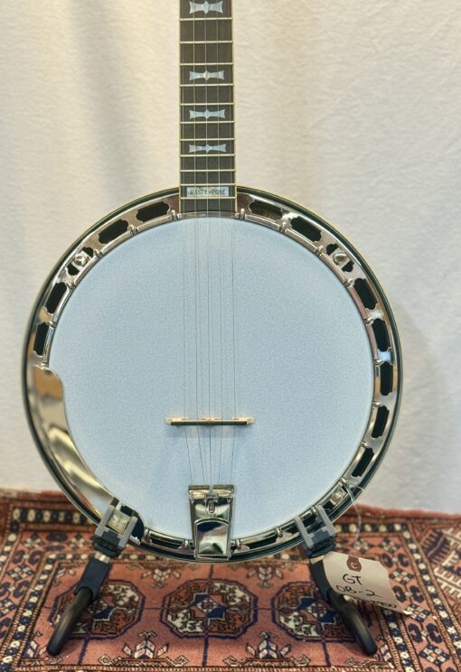 Gold Tone Mastertone OB-2 banjo front view on stand, showing chrome hardware and blue head