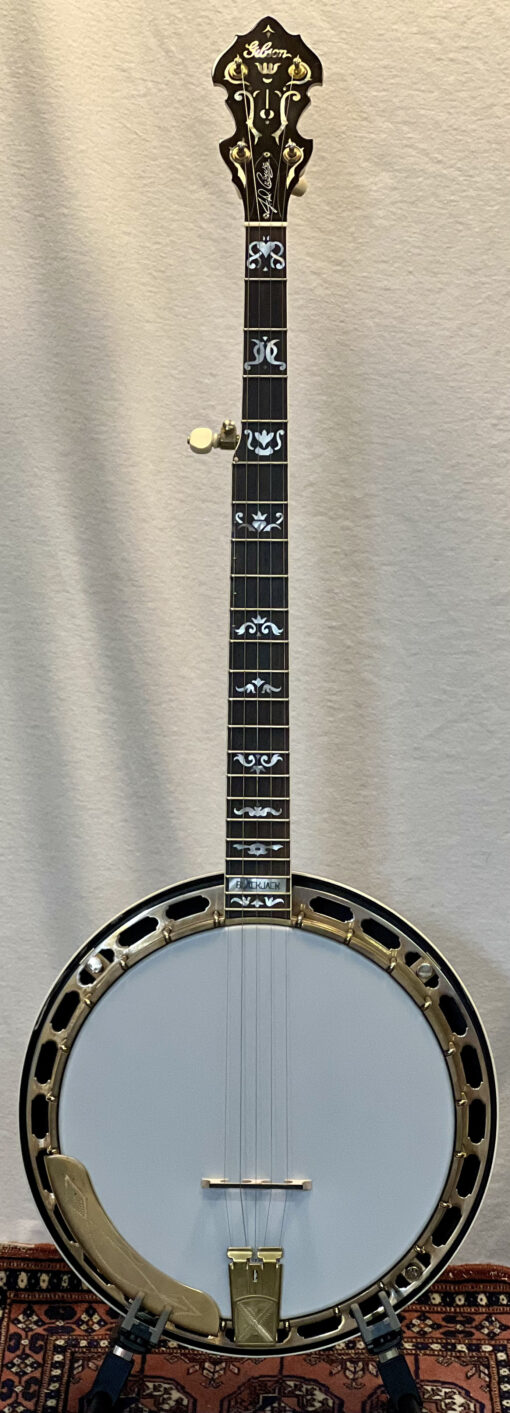 Multiple views of a 2006 Gibson RB-75 JD Crowe Blackjack banjo showing mahogany neck and resonator with antique red finish, exclusive Blackjack mother-of-pearl inlays, copper-flashed satin gold hardware, and original Gibson case