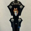 Stelling Red Fox banjo headstock showing red fox inlay and Stelling logo on black ebony.