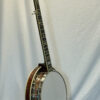 Three-quarter rear view of Stelling Red Fox banjo highlighting flame maple and overall proportions