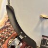Recording King RKR-80 armrest detail showing black armrest mounted on nickel-plated brackets