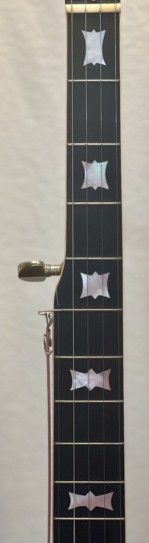 Bowtie mother-of-pearl inlays on ebony fingerboard of 1969 Gibson RB-250 banjo