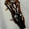 Rich & Taylor banjo headstock side profile showing mahogany construction and quality tuning machines