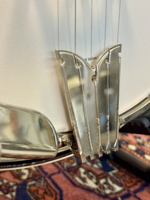 Rich & Taylor banjo tailpiece and string hardware detail showing professional grade components.