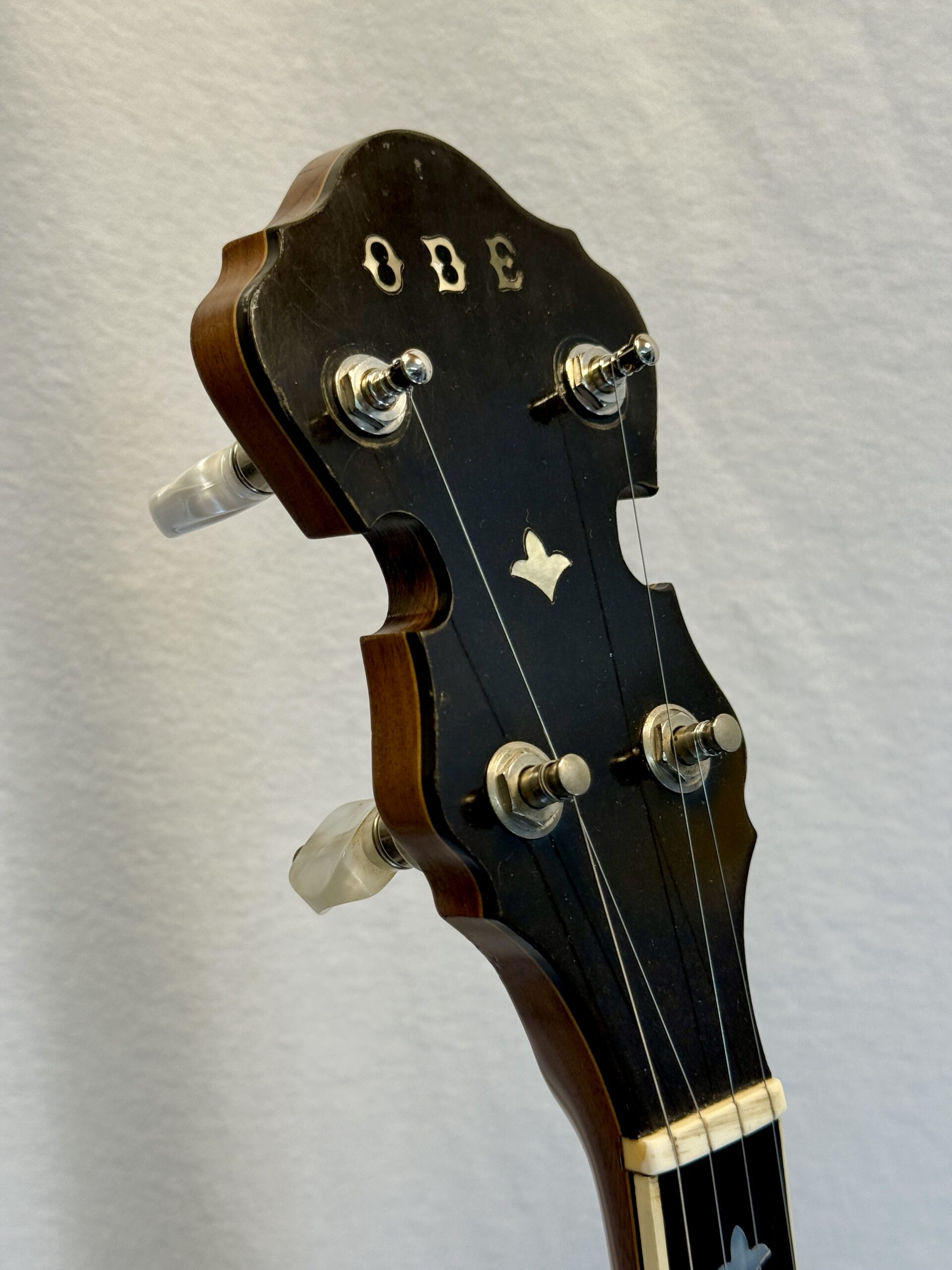 ODE Style C banjo peghead with mother-of-pearl inlay