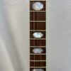Middle frets of 2005 Gibson RB-18 Top Tension showing Art Deco bowtie pearl inlays on rosewood fingerboard