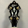 Closeup of Gibson peghead with flying eagle mother-of-pearl inlay and gold tuners