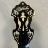 Peghead of Shelby Blackhawk banjo with pearl flying eagle inlay and Shelby script logo
