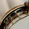 Angled front view of Shelby Blackhawk banjo with pearl inlays and nickel hardware