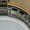 Detail of Gibson TB-4 coordinator rods, one-piece flange, and Mastertone fingerboard inlay where neck meets pot.