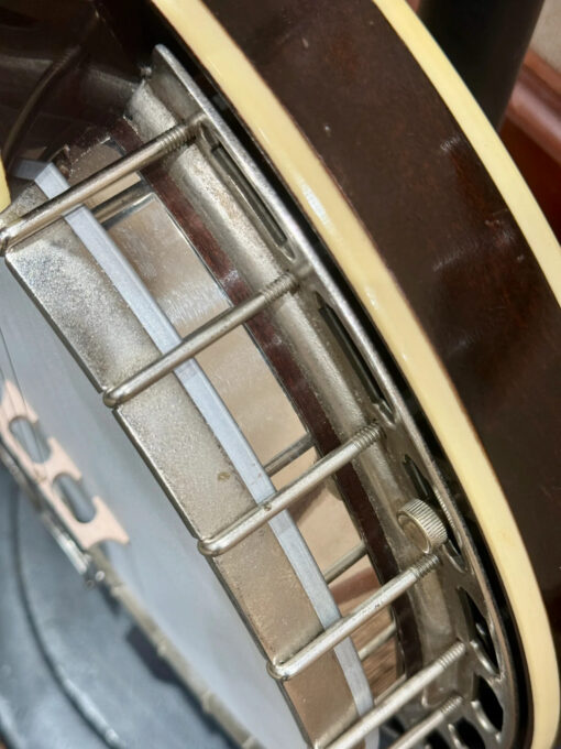 Side view of 1932 Gibson TB-1 showing coordinator rods, one-piece flange construction, and resonator