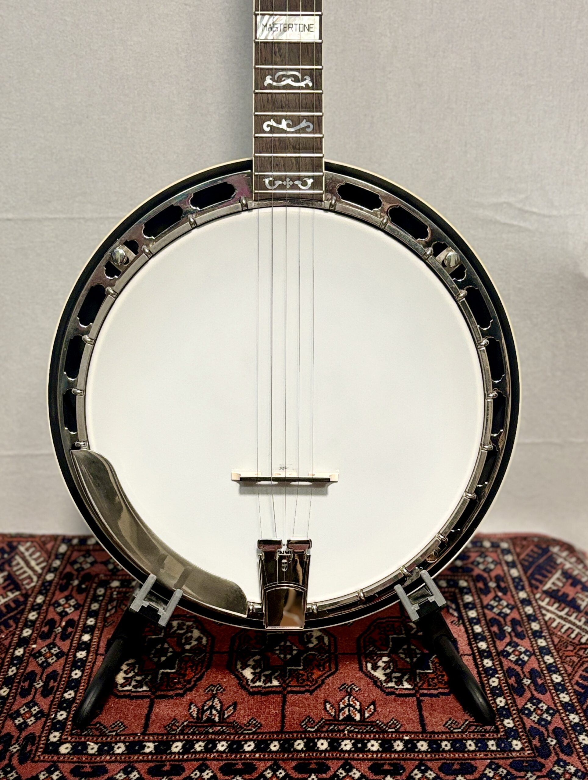 Close-up of Gibson RB-3 banjo pot showing Mastertone block inlay on fretboard, white frosted head, nickel flathead tone ring, and resonator flange