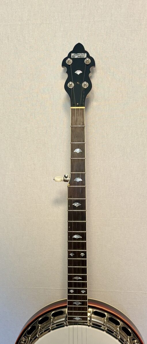 Recording King banjo peghead with original logo and fan-shaped pearl inlay