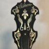 1932 Gibson TB-3 Mastertone banjo - peghead close-up showing Gibson logo and ornate pearl inlay work