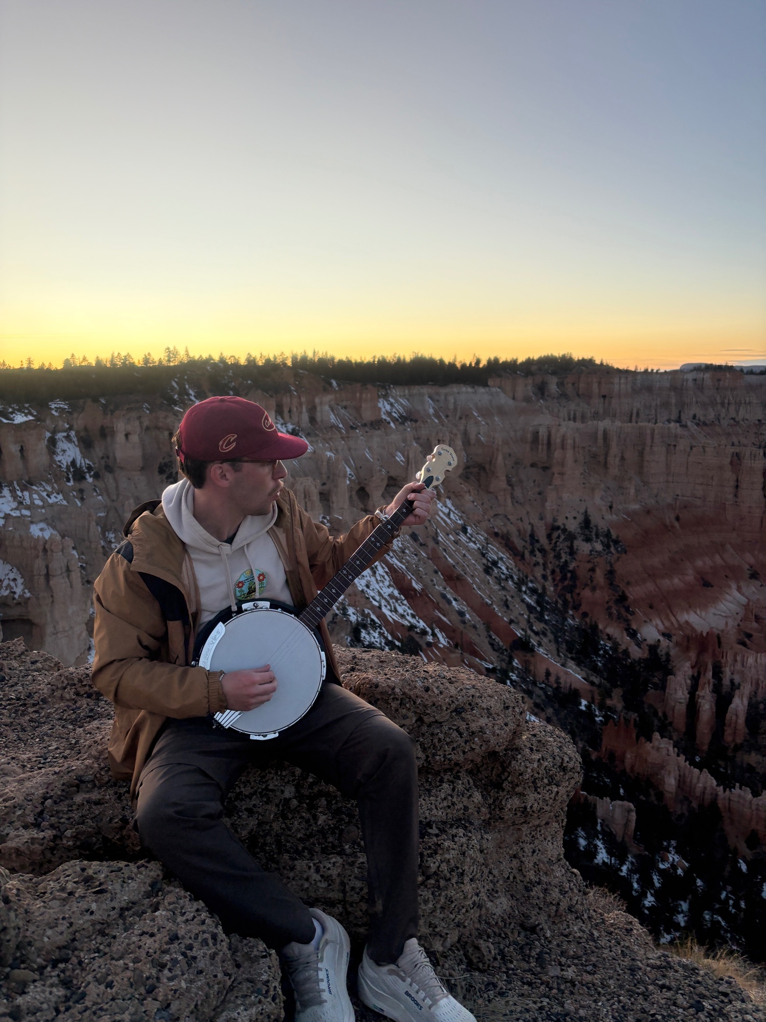 Jake Welter, Data Engineer at Banjo Warehouse, playing a Gold Tone CC-100R banjo at Bryce Canyon