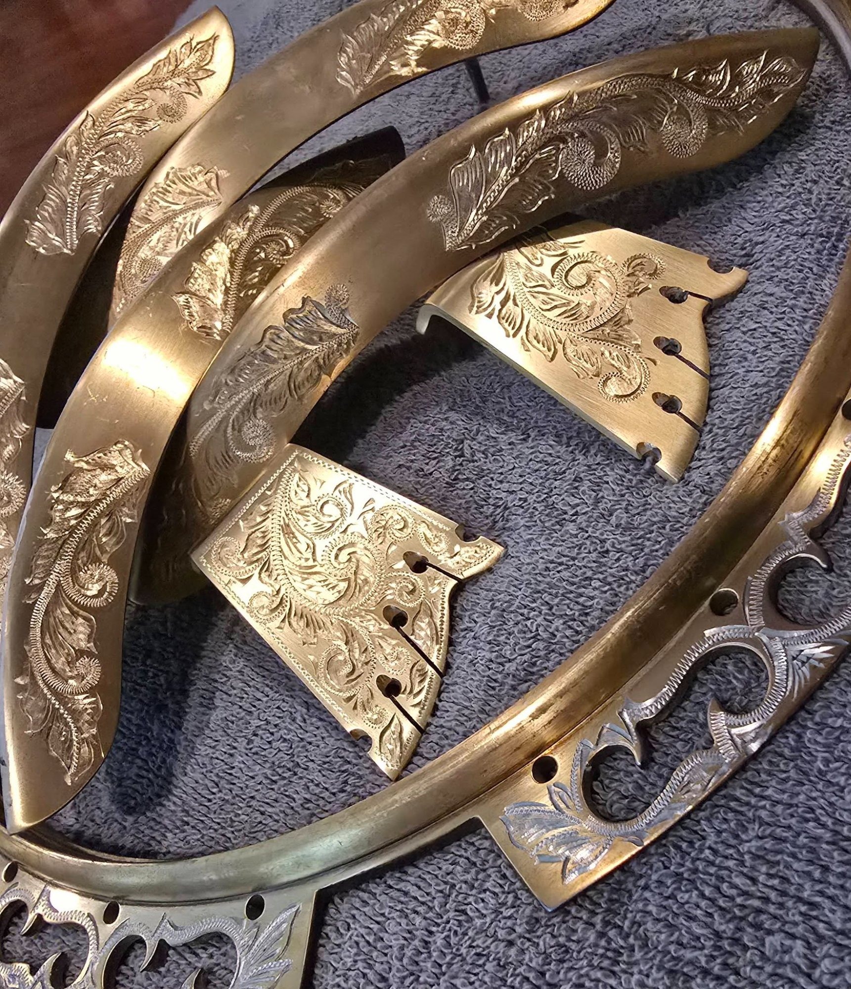 Greg Rich hand-engraved OME Ikon banjo flange detail showing scrollwork and floral engraving