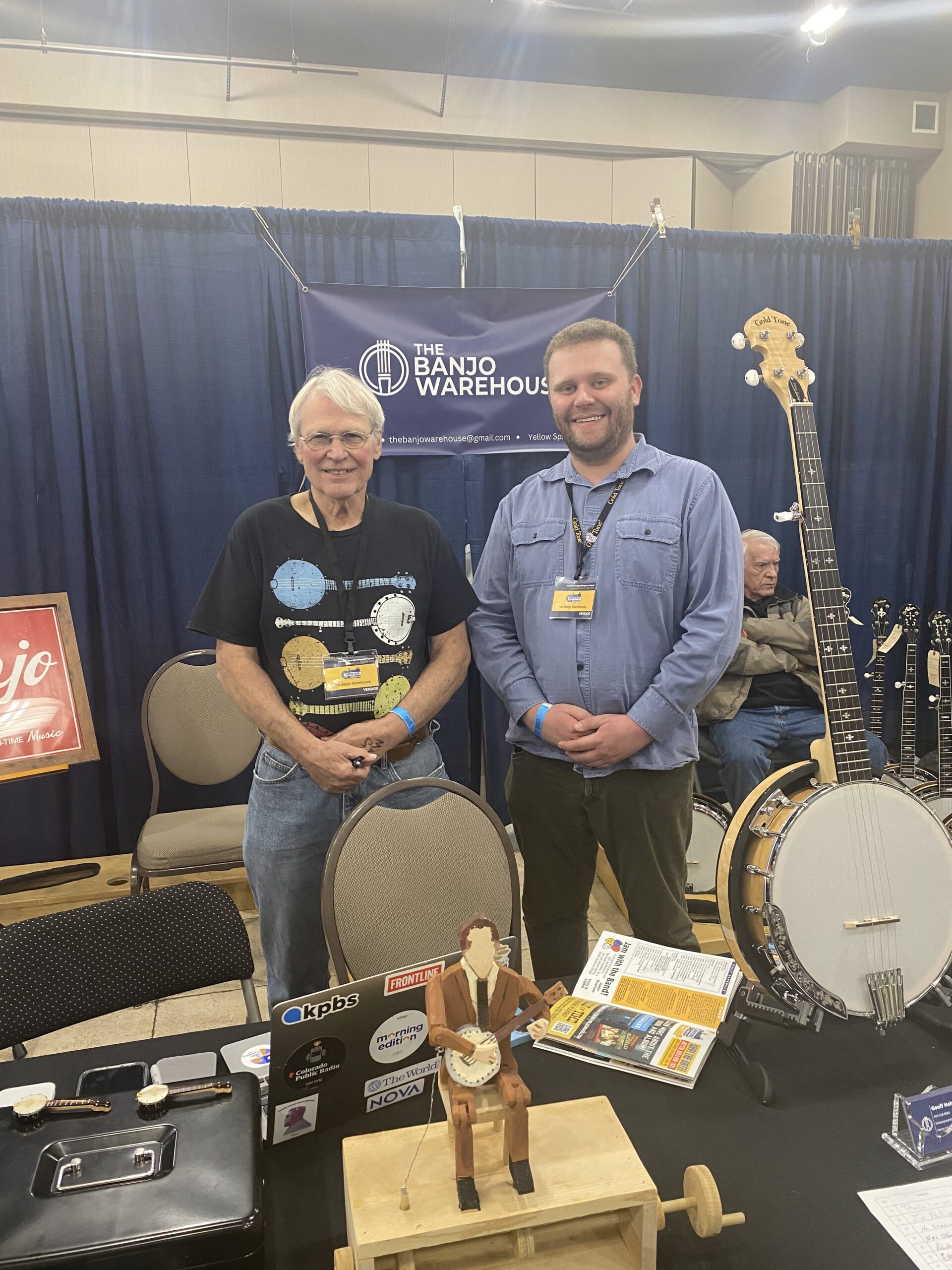 Chris Welter and Geoff Hohwald at the Banjo Warehouse booth with Gold Tone banjos on display