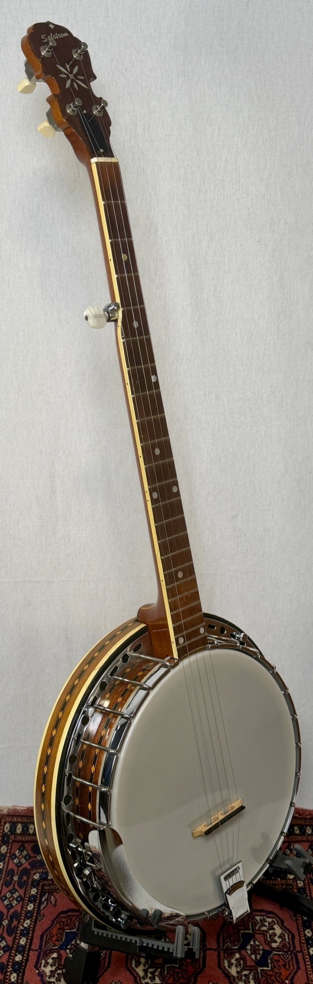 Salstrom B5-C bluegrass resonator banjo front angle view showing resonator rim inlay and rosewood fingerboard at Banjo Warehouse