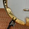 Detail of the hand-engraved Dogwood blossom motif on the gold-plated lower flange of the 1987 Stelling One-Bird Virginian, the same Dogwood theme that runs across the tailpiece and armrest.