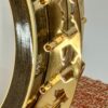 Serial number 3149 stamped on the inside of the rim of the 1987 Stelling One-Bird Virginian, with the gold-plated flange and Dogwood-cutout pattern visible in the foreground.