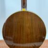 Back view of the figured walnut resonator on the 1987 Stelling One-Bird Virginian, showing the cream-colored binding around the resonator edge and the gloss finish that has held up cleanly over nearly four decades of single-owner care.