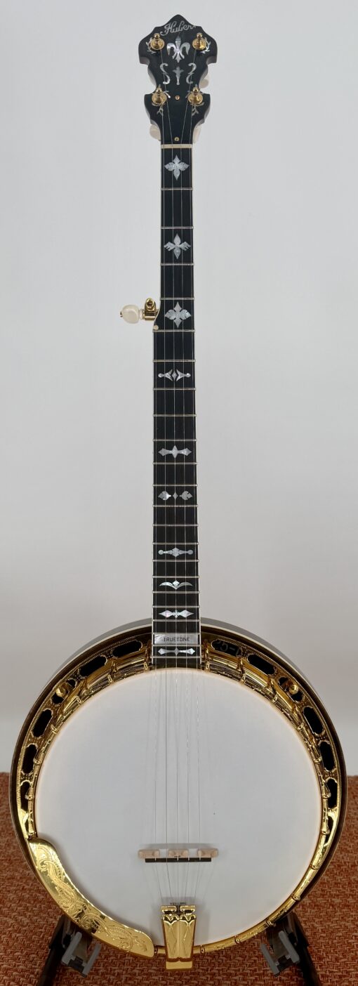 Huber Truetone Custom 625-13 bluegrass resonator banjo front view, gold engraved Style 6 hardware, ebony fingerboard with mother of pearl inlays, on display at Banjo Warehouse in Yellow Springs, Ohio Front view of the Huber Truetone Custom 625-13, a Style 6 bluegrass resonator banjo with engraved gold hardware, available at Banjo Warehouse in Yellow Springs, Ohio.