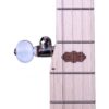 Close-up of an Art Deco hardwood inlay on the maple fingerboard and the geared 5th string tuner with a white button on the Deering Goodtime Americana banjo.