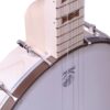 Close-up of the Deering Goodtime Americana banjo where the maple neck meets the rim, showing the Deering head logo and bronze hardware.