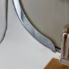 Chrome armrest detail on a 1970s GTR banjo showing light vintage wear