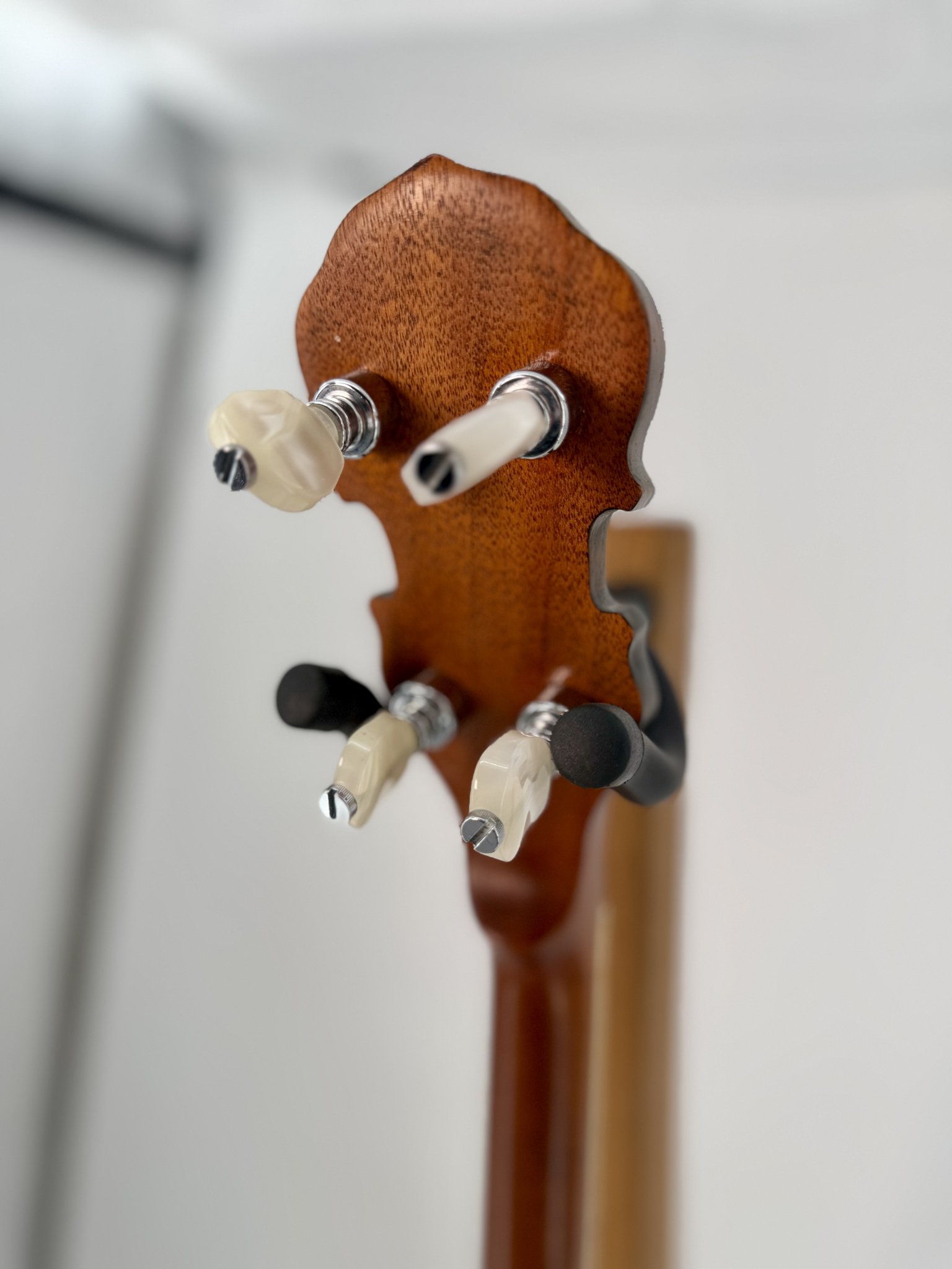 Back of the fiddle-shaped peghead and tuners on a GTR Hearts and Flowers banjo