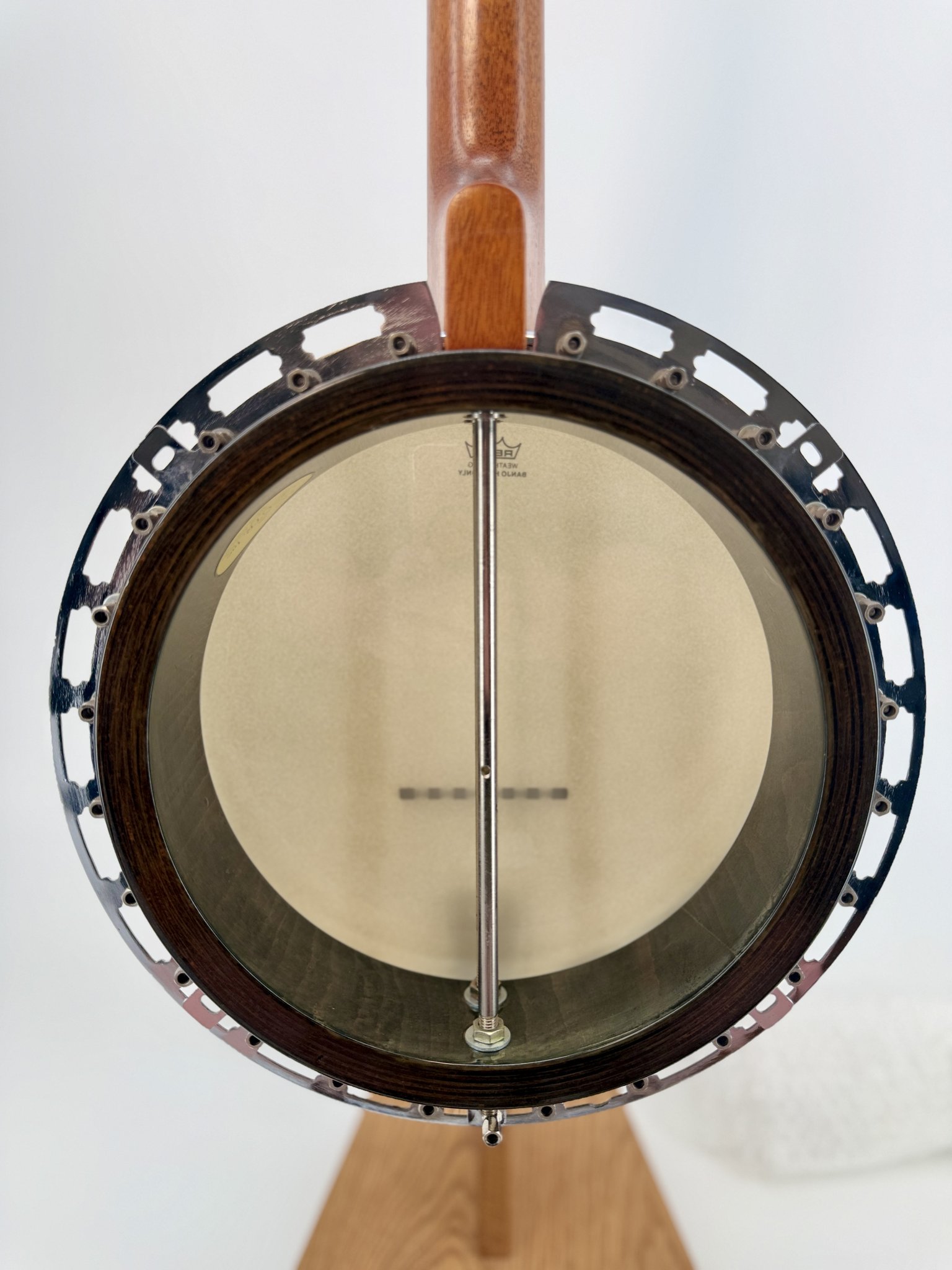 Inside the rim of a GTR banjo showing the coordinator rod with resonator removed