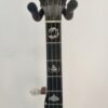 Peghead and upper neck of a Crafters of Tennessee Maple Classic banjo with the Crafters script inlay