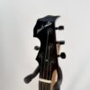 Nechville Zeus headstock front with the pearl Nechville logo and black-button tuners
