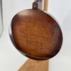 Angled back view of the Nechville Zeus curly maple resonator in sunburst
