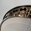 Close-up of the ornate Stelling pierced cut flange and resonator binding