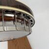 Underside view of the Stelling Sunflower flange, bracket band, and figured maple resonator rim