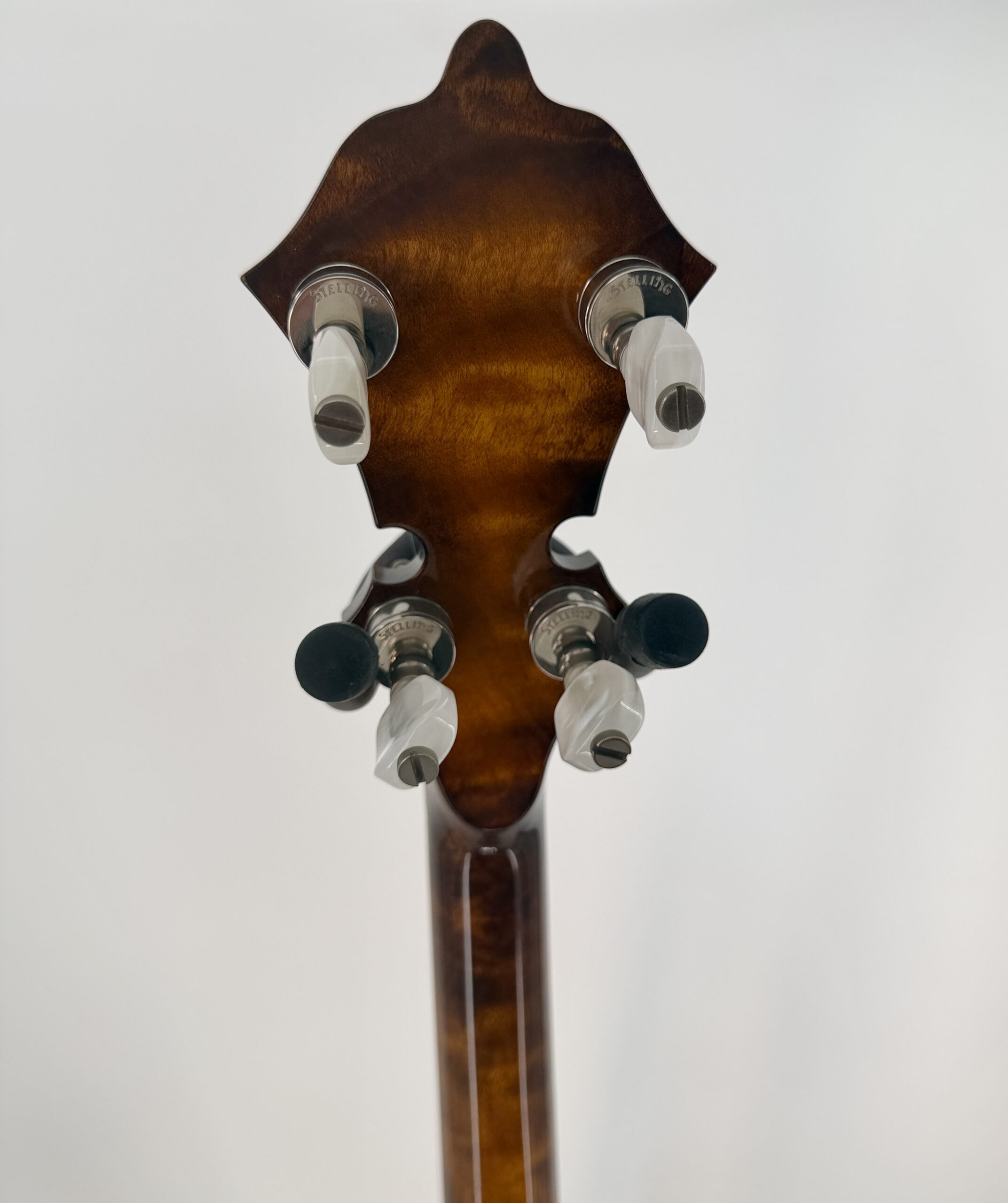 Back of the Stelling Sunflower headstock with Stelling stamped tuners and pearloid buttons