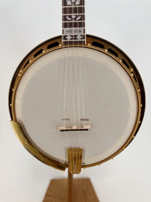 Pot front of a 1925 Gibson TB-Granada with gold flange and armrest