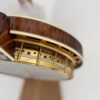 Tone ring skirt and hooks under the flange of a 1925 Gibson TB-Granada