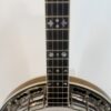 Ebony fingerboard with pearl fleur-de-lis and half-moon inlays on a 1980 ODE Style C