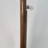 Back of the walnut neck with laminated center stripe and fifth string tuner