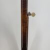 2009 Stelling Golden Cross banjo with a close view of the curly maple neck back and fifth-string peg, at Banjo Warehouse in Yellow Springs, Ohio.