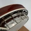 2010 Flint Hill FHB-280A banjo with a side view of the bound mahogany resonator, flange and resonator hooks, at Banjo Warehouse in Yellow Springs, Ohio.