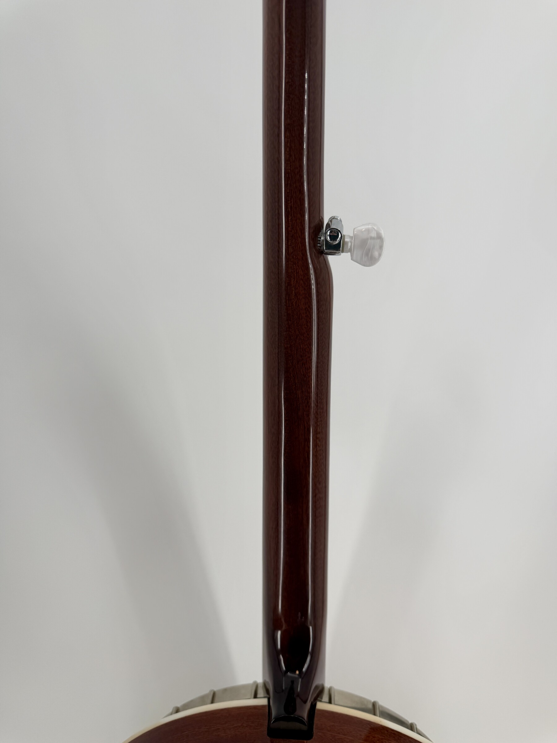 2010 Flint Hill FHB-280A banjo with the back of the mahogany neck, fifth-string peg and heel, at Banjo Warehouse in Yellow Springs, Ohio.