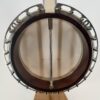 Inside of the pot of a Clancy Mullins banjo with the resonator off, coordinator rod