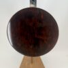 Curly maple resonator back of a Clancy Mullins banjo, honest wear