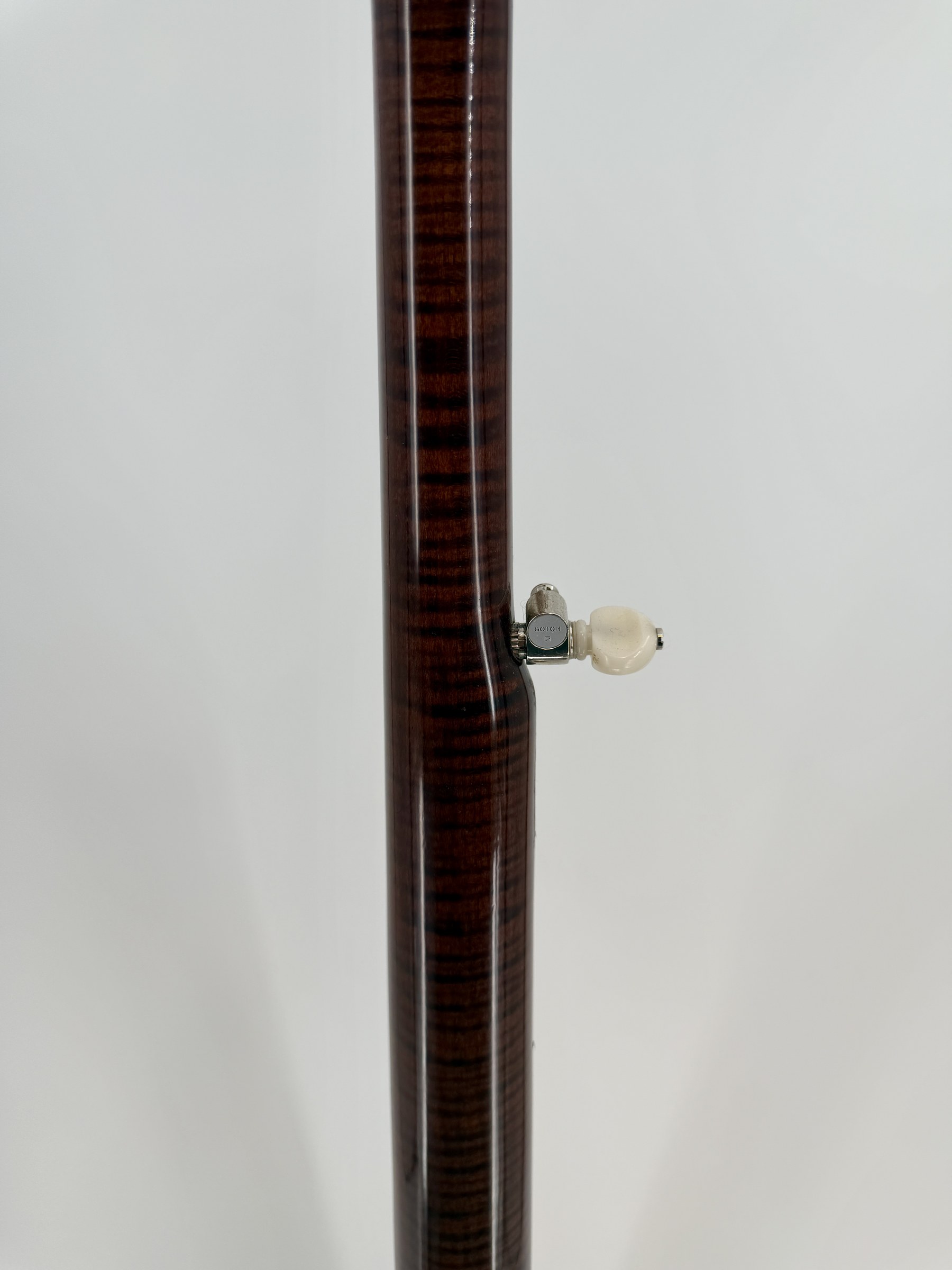 Curly maple neck and Gotoh fifth-string tuner of a 2015 Davis Concord Prototype