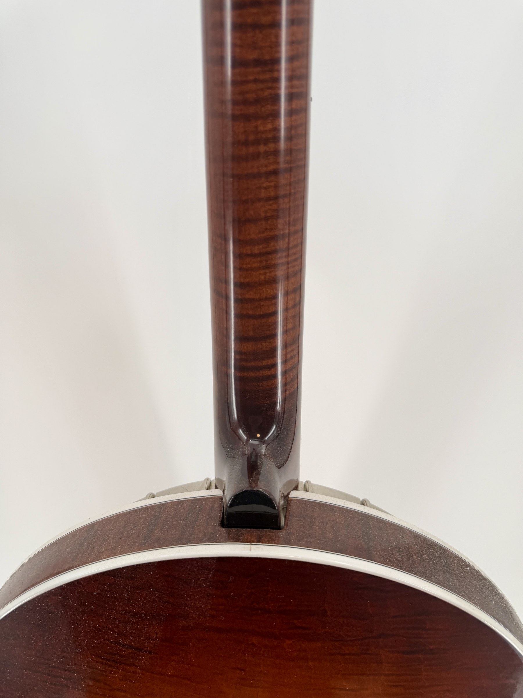 Neck heel meeting the resonator of a 2015 Davis Concord Prototype