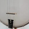 Deering Goodtime 19-Fret Tenor openback banjo with its Goodtime Smile bridge and Goodtime tailpiece, at Banjo Warehouse in Yellow Springs, Ohio.