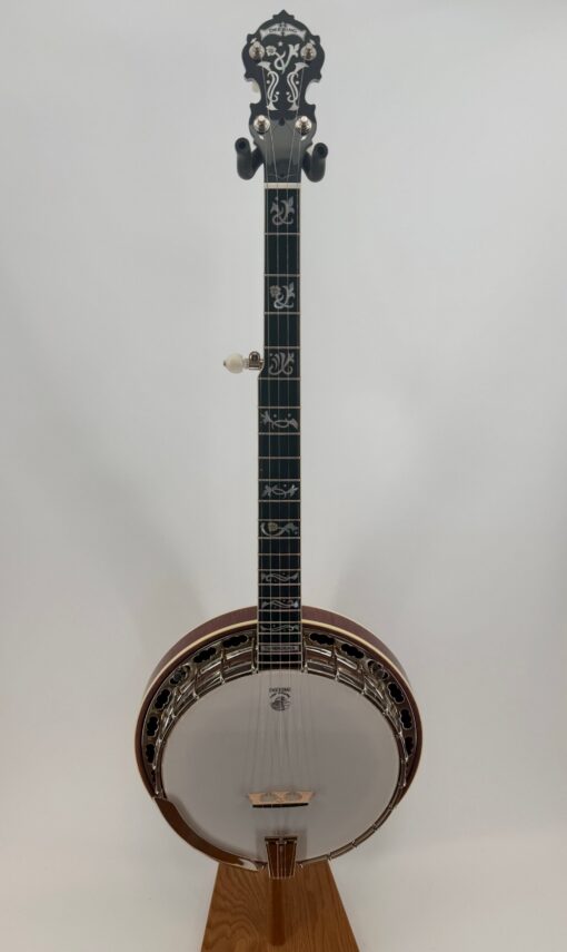 Full front view of a Deering Tenbrooks Saratoga Star five-string resonator banjo with a radiused ebony fingerboard, Art Nouveau pearl inlays and a Tenbrooks Red curly maple neck and resonator.